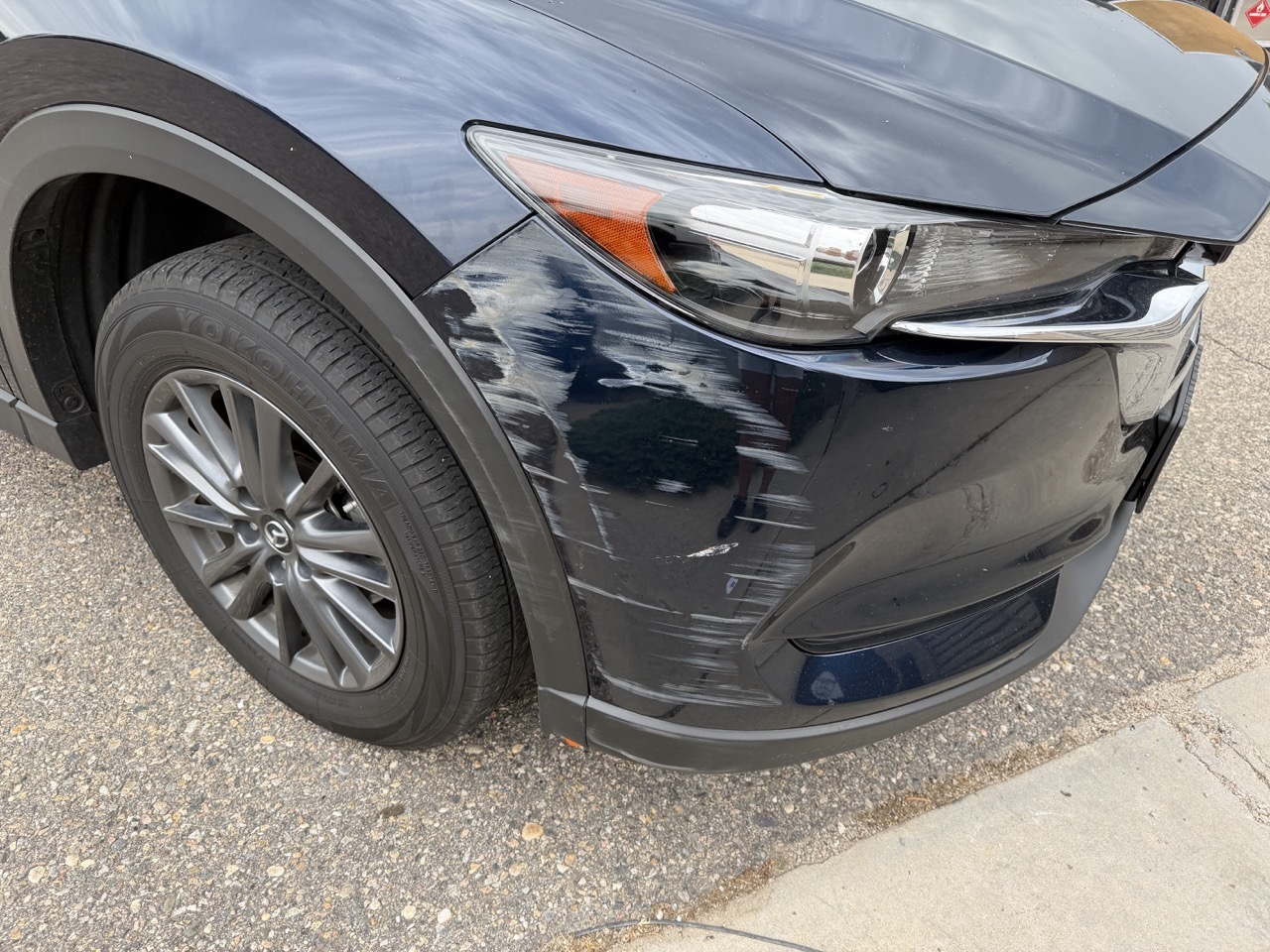 Mazda bumper damage before repair